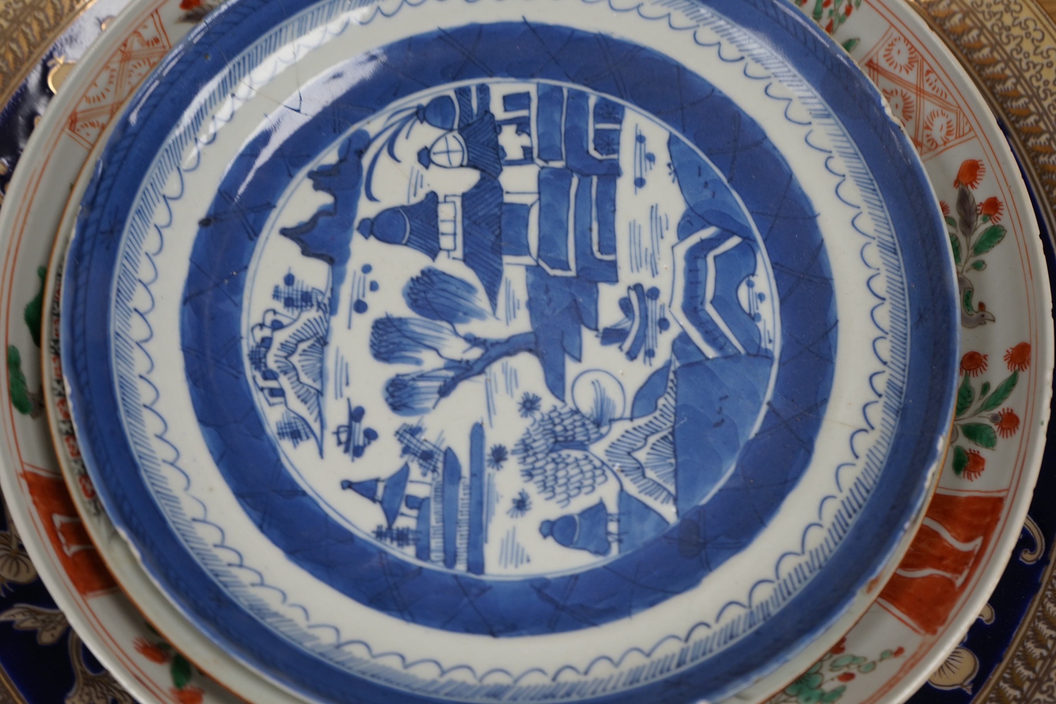 A group of 18th century and later Chinese enamelled and blue and white porcelain dishes and three bowls, Largest dish 35.5 cm diameter